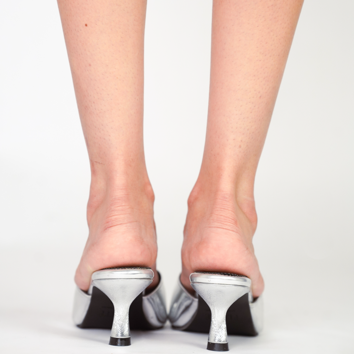 Mirror silver pointed-toe vegan leather kitten heels with black lining