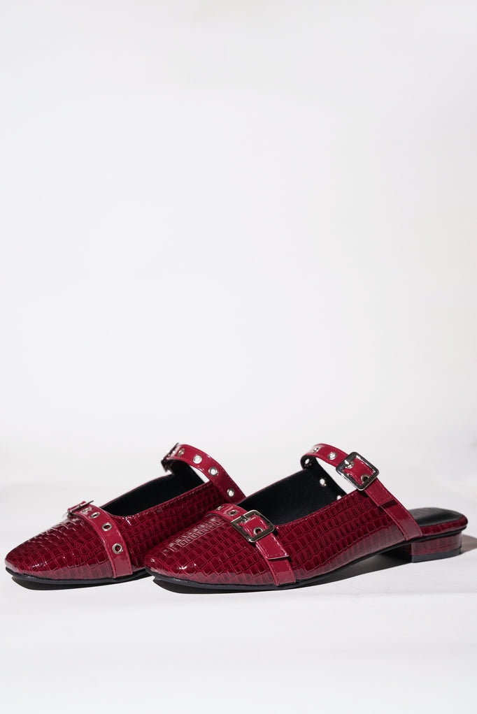 Red croc-textured Mary Jane flats with silver buckle straps