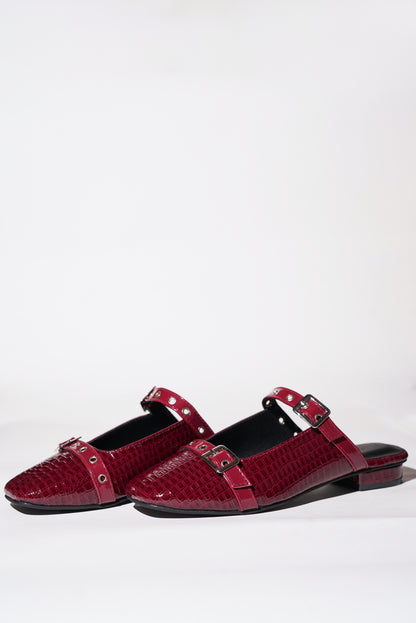 Red croc-textured Mary Jane flats with silver buckle straps