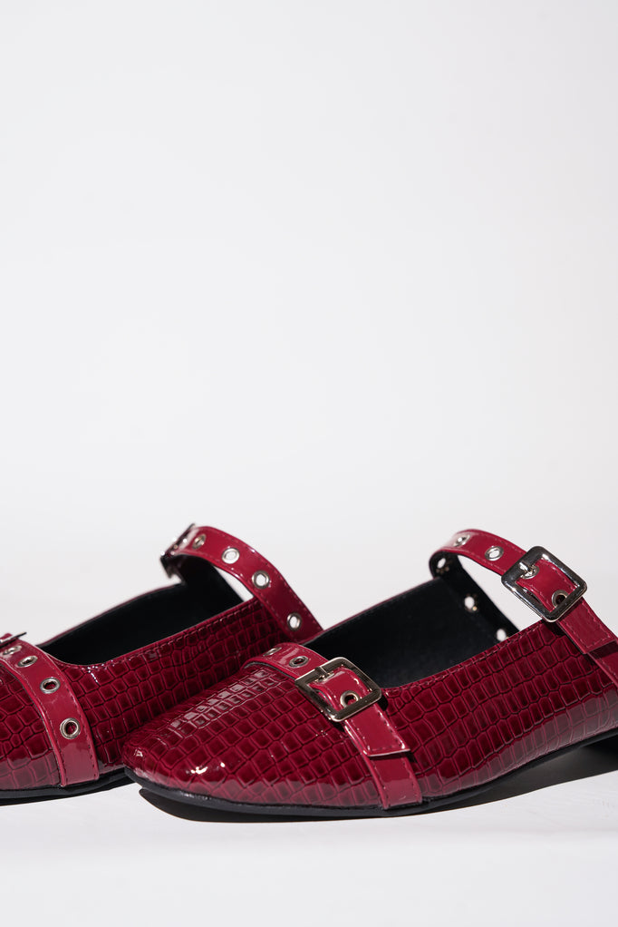 Red croc-textured Mary Jane flats with silver buckle straps