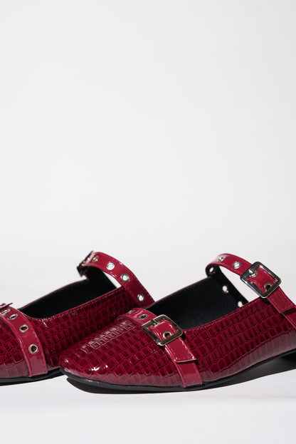 Red croc-textured Mary Jane flats with silver buckle straps
