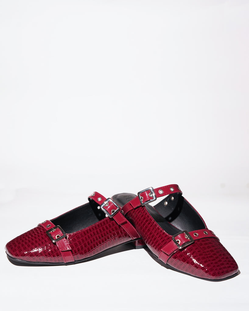 Red croc-textured Mary Jane flats with silver buckle straps