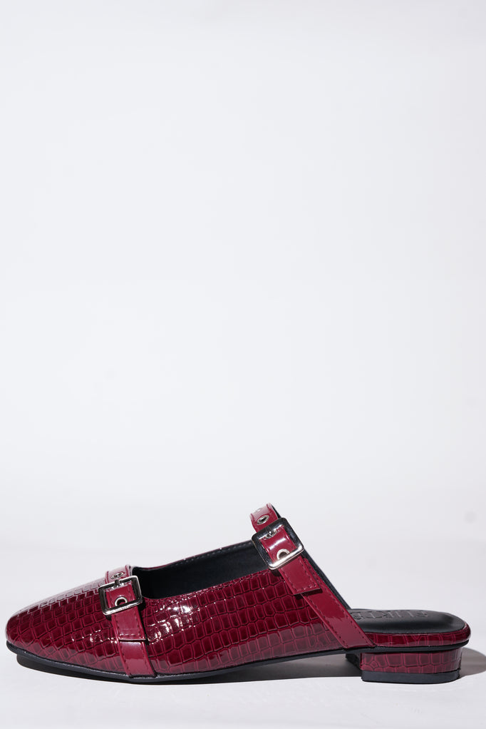 Red croc-textured Mary Jane flats with silver buckle straps