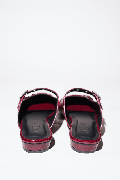 Red croc-textured Mary Jane flats with silver buckle straps